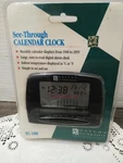 New Oregon Scientific See Through Calendar Clock TC-188 (sealed). Fixed Price $29.98.
