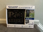 Sharp SPC1107A Black Digital Atomic Wall Clock Jumbo Display Weather Station New. Fixed Price $35.00.