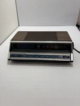 Vintage General Electric 7-4662B Am/fm Alarm Clock Radio Wood Grain. Fixed Price $50.00.