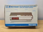Emerson Fm/am Digital Clock Radio Red 5511 Simulated Walnut Grain Box. Fixed Price $20.00.