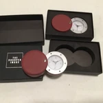 Sharper Image.. Red Travel Folding Leather 4 Digital Alarm Clock Quantity 2. Fixed Price $20.00.