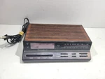 Realistic Chronomatic 267 Am/fm Alarm Clock Radio 12-1575 In Brown Color. Fixed Price $18.19.