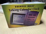 Sharper Image Travel Talking Alarm Clock With Date & Temperature. Fixed Price $14.99.