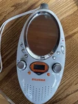 Sylvania SRS55 Sports Water Resistant Shower Clock Radio W/mirror; Hang Stand. Fixed Price $10.00.