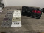 Vintage General Electric Clock Radio Alarm 7-4915A & 1980S Cassettes. Fixed Price $118.00.