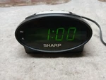 Sharp Lcd Alarm Clock SPC040. Fixed Price $14.95.