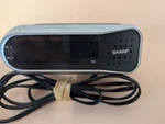 Sharp Digital Compact Clock Radio Led Display Battery Backup Snooze Model SPC100. Fixed Price $16.95.