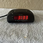 Slick CR212 Am/fm Alarm Clock Radio Battery Backup Good Used Condition. Fixed Price $7.00.