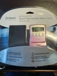 New Pink Oregon Scientific Self-setting Atomic Travel Thermometer Alarm Clock. Fixed Price $34.25.