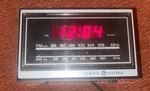 Vintage General Electric 7-46200 Am/fm Digital Alarm Clock Teak Grain Finish. Fixed Price $17.99.