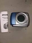 Sylvania SCR1320S-SILVER Projection Alarm Clock Radio Digital Display (works). Fixed Price $25.99.