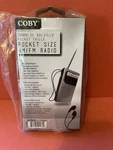 Coby CR-203-SLV Pocket Am/fm Radio Silver W/ Earbuds Portable Analog Sealed. Fixed Price $15.00.