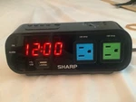 Sharp Alarm Clock SPC137 With 120V 5AMP Ac Outlets And Usb Plug C2. Fixed Price $20.00.