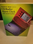 Sharper Image Cd Radio Alarm Clock W/sound Soother SI586. Fixed Price $59.99.