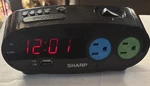 Sharp Alarm Clock With Power Outlets And Usb Charge Port - Model SPC136 Used. Fixed Price $11.78.