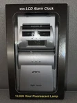 1997 Nos Lighttraveler Book With Lcd Alarm Clock D3271S-W. Fixed Price $20.00.