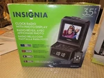 Insignia Photo Display Digital Alarm Clock Radio NS-DPFC01 New Open Box. Fixed Price $15.00.