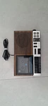 General Electric Model 7-4956A Clock Radio Wood Grain Finish On Plastic. Fixed Price $20.00.