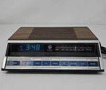 General Electric 7-4662C Am/fm Clock Radio Woodgrain Finish Tested. Fixed Price $32.50.