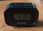Sharp Digital Alarm Clock SPC438- Blue Backlight Battery Operated Black. Fixed Price $7.99.