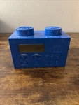 Blue Lego Portable Clock Radio (model: LG11007). Fixed Price $16.00.