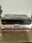 Cosmo Am/fm Clock Radio.model CR-2026C In Box Sealed. Fixed Price $20.00.