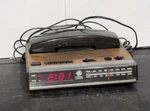Vintage Am/fm Radio Alarm Telephone Clock General ELECTRIC#7-4711C Woodgrain. Fixed Price $18.25.