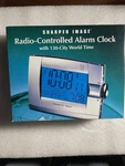 Sharper Image - Radio Controlled Alarm Clock New In Box. Fixed Price $25.00.