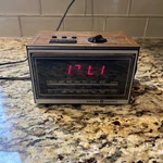 Vintage General Electric 7-46200 Am/fm Digital Alarm Clock Teak Grain Finish. Fixed Price $16.40.