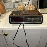 Vintage General Electric Wood Grain Am/fm Radio Alarm Clock 7-4635B. Fixed Price $30.00.