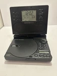 Sharper Image Portable Cd/ Am-fm Radio Alarm Clock. Fixed Price $35.00.