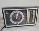 General Electric Clock Radio 7-4501D Black Am Fm Woodgrain Alarm (parts Only). Fixed Price $22.00.