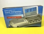 Sharper Image Travel Companion Alarm Clock & Flashlight With Intruder Alert. Fixed Price $12.00.