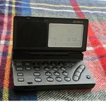 Sony ICF-SW100 Portable Am/fm Shortwave World Band Receiver W/ Case & Ac Adapter. Fixed Price $450.00.