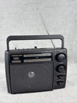 Soundesign Band Lcd Alarm Clock Radio W/ Battery Backup Model 2448BLK. Fixed Price $20.00.