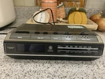 Vintage General Electric Clock Radio 7-4642F Alarm Blue Display Woodgrain 80S. Fixed Price $25.00.