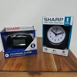 Brand New Sharp Battery Operated Quartz Analog Alarm Clock Lot Of 2. Fixed Price $22.99.