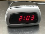 Sharp SPC085 Small Digital Alarm Clock W Battery Backup And Snooze Button. Fixed Price $19.99.