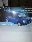 Sharper Image New Beetle Projection Alarm Clock Fm Radio 2004 In Box Collection. Fixed Price $300.00.