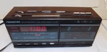 Vtg Sounddesign 3838WAL Am Fm Electronic Clock Radio Cassette Player Wood Grain. Fixed Price $21.60.