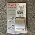 The Timex Flip Top Travel Alarm Clock Am/fm Portable Radio Model T315S. Fixed Price $59.00.