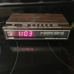 Vintage Sonic Digital Clock Radio CR100B Am/fm Alarm Red Digits Wood Grain Black. Fixed Price $22.00.