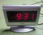 Sharp SPC060 Alarm Clock- Silver With Red Led Screen. Fixed Price $11.88.