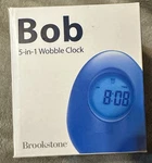 Brookstone "bob" 5-IN-1 Wobble Clock Blue New. Fixed Price $15.00.