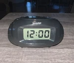 Sharp Lcd Digital Alarm Clock, Black, SPC500A Easy To See Blue Display. Fixed Price $8.00.
