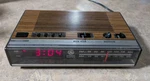 General Electric Wood Grain Digital Radio Alarm Clock Model 7-4624B. Fixed Price $25.90.