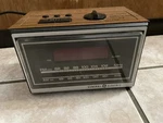 Vintage 1971 7-4620A General Electric Teak Wood Grain Radio Alarm Clock Seka. Fixed Price $13.99.