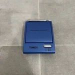 The Timex Flip Top Travel Alarm Clock Blue Am/fm Portable Radio Model T315S. Fixed Price $24.99.